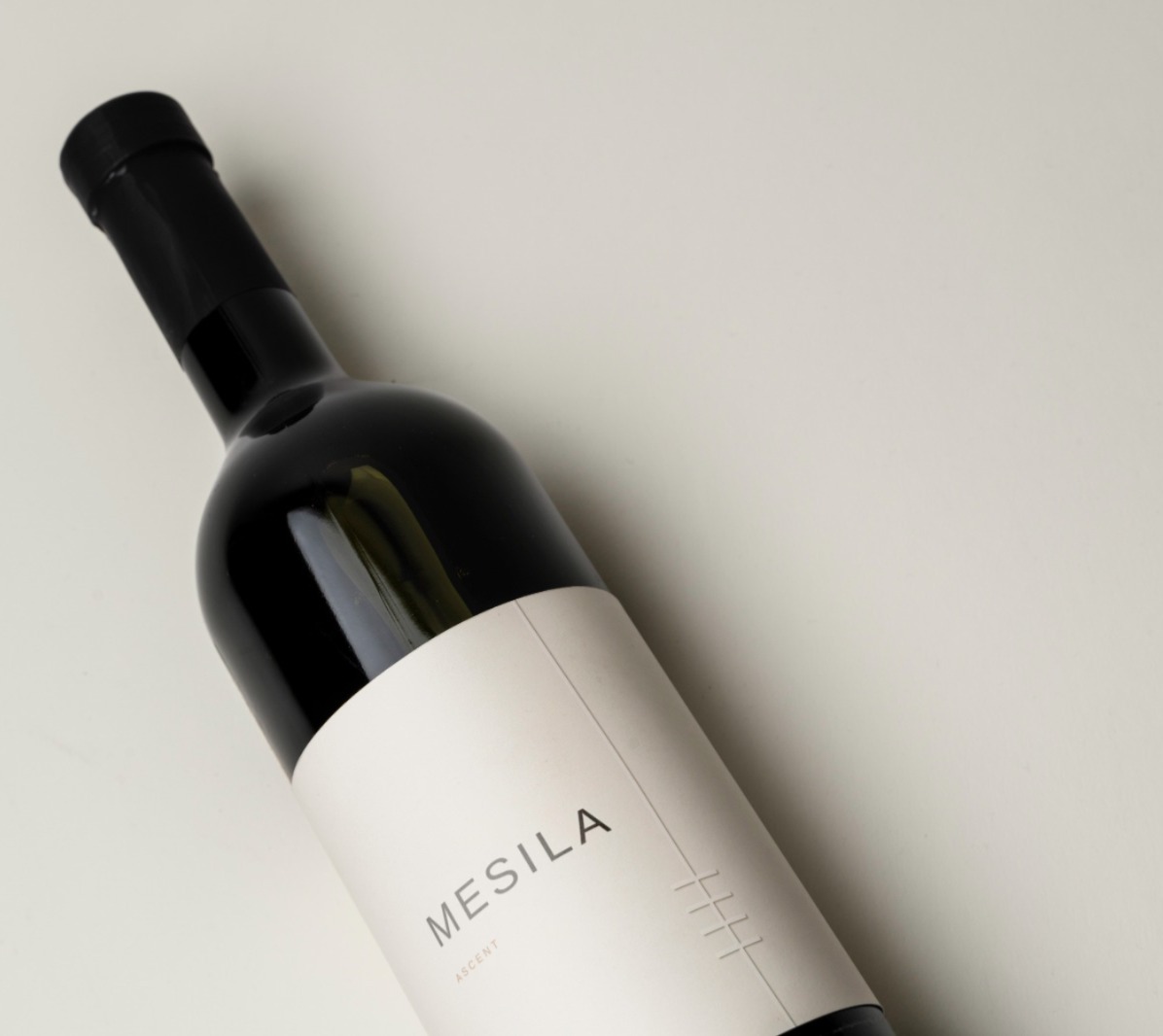MESILA bottle lying on a light surface