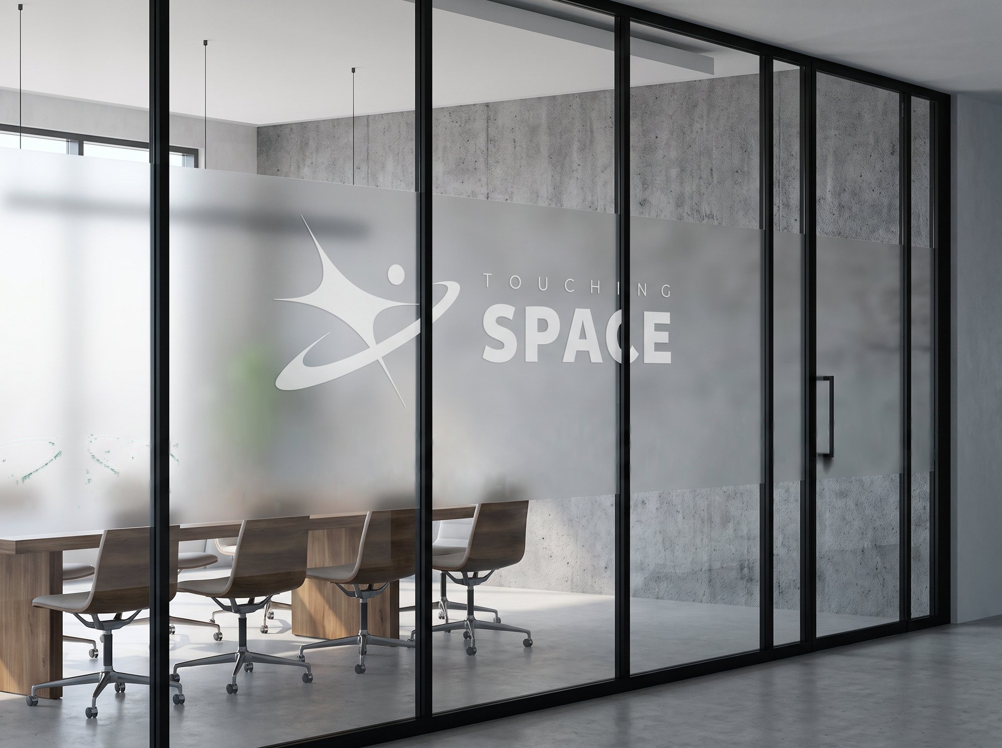 Touching Space logo frosted on an office glass wall